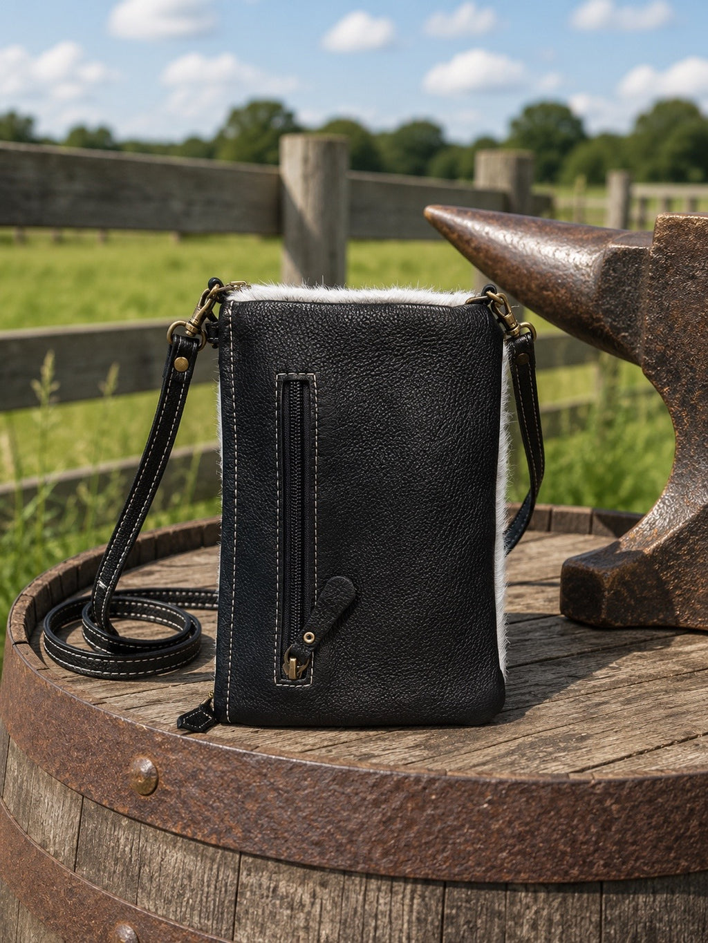 Wild Chic phone case bag back view showing ebony leather with zippered pocket