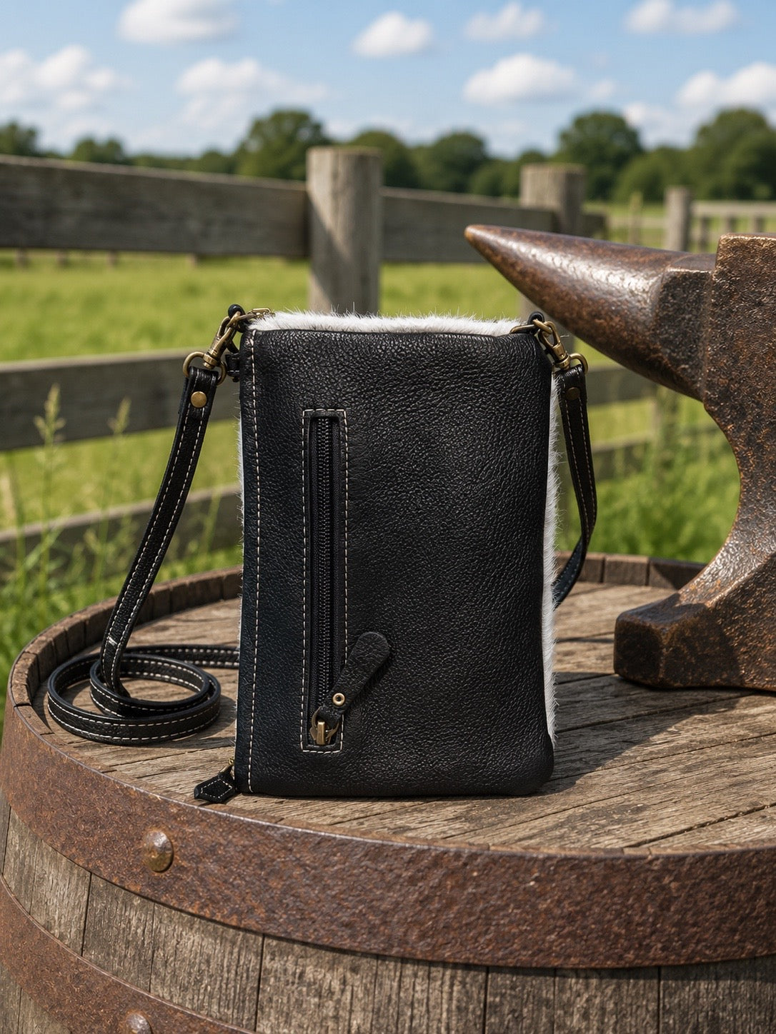Wild Chic phone case bag back view showing ebony leather with zippered pocket