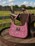Loyal West Dannia medium purse in pink showing front hand-tooled floral detail with turquoise clasp