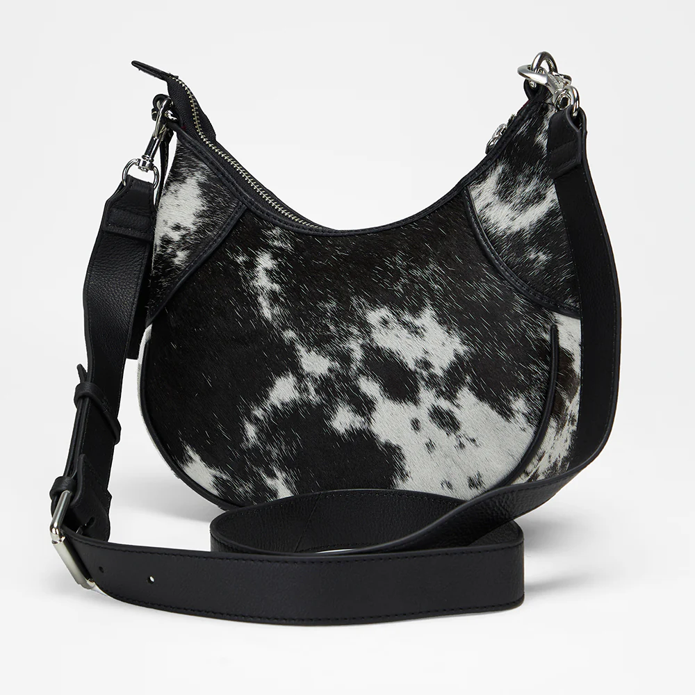 Loyal West Lueve hairon leather bag with removable black adjustable crossbody strap on white background