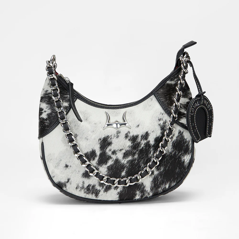 Loyal West Lueve hairon leather bag with chain-link strap and silver longhorn hardware on white background