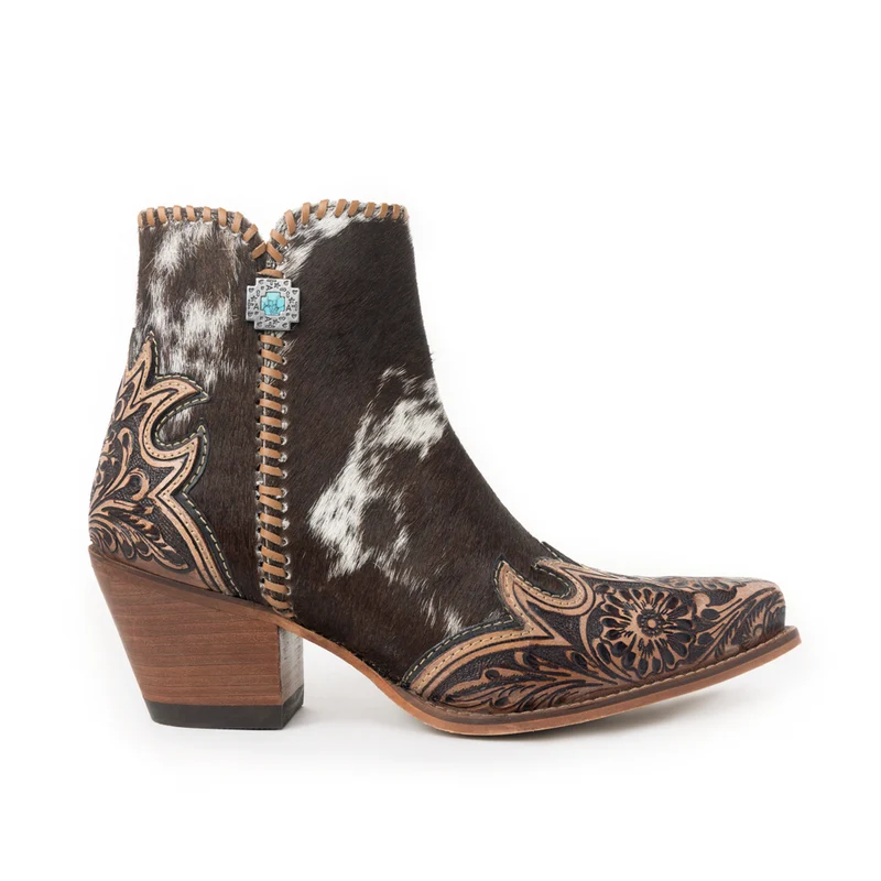 Side view of Margie hair-on hide ankle boot with floral tooled leather and decorative medallion