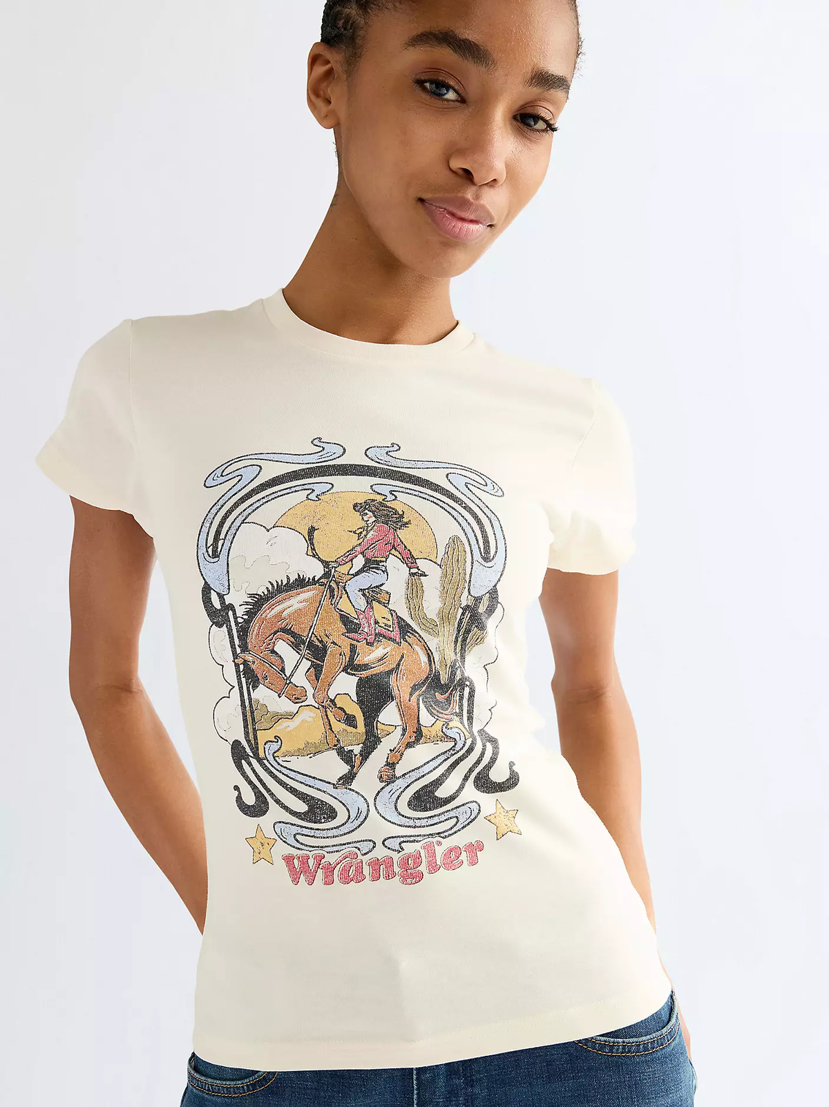 Close-up of Wrangler off-white T-shirt with a western rider graphic and Wrangler logo